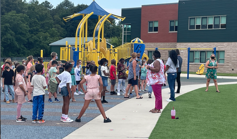HOB Assistant Principal Equetta Jones entertains students as they line up at the end of recess. SUBMITTED PHOTO